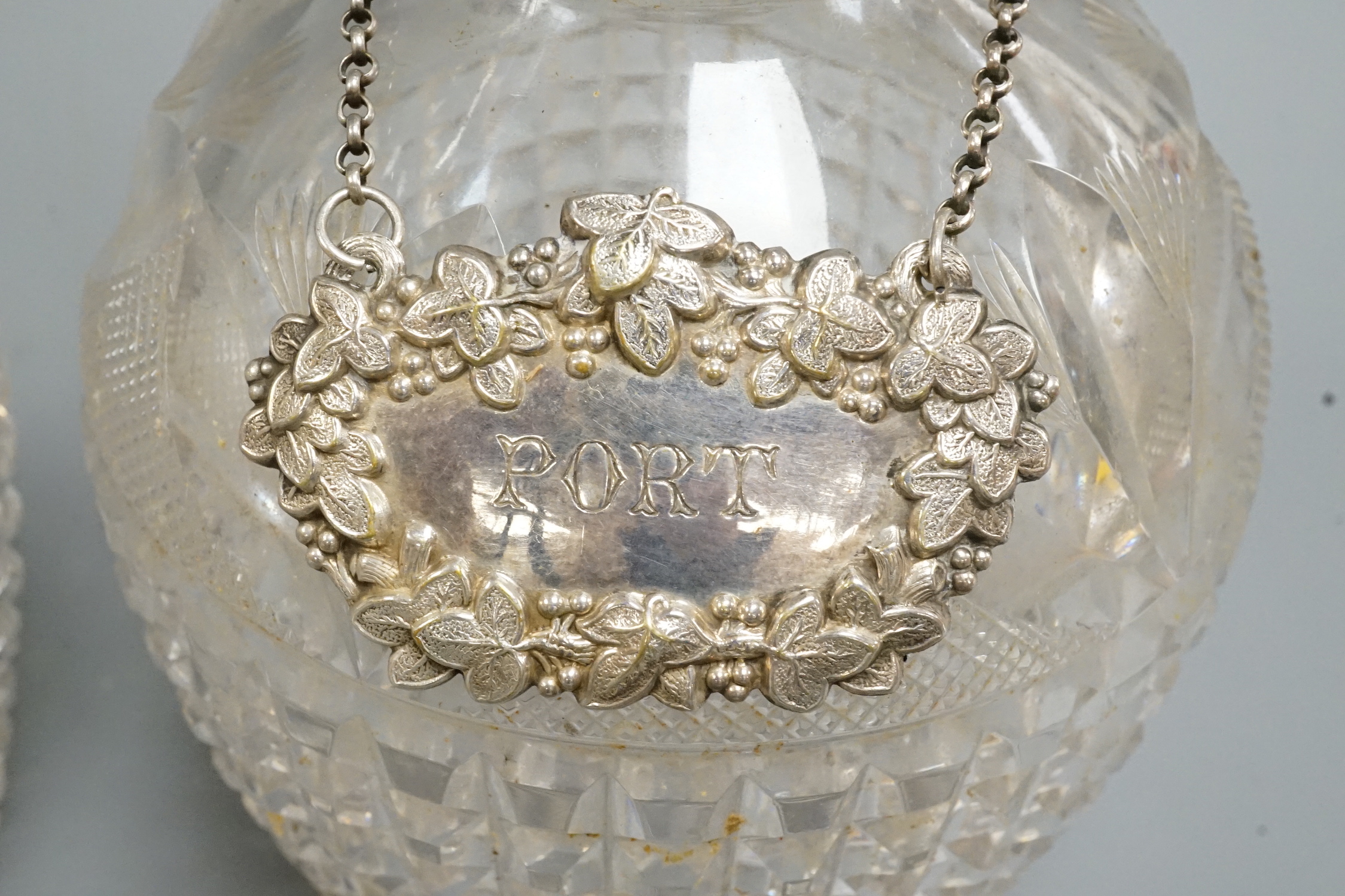 A near pair of George V silver mounted cut glass decanters and stoppers, by Hukin & Heath, Birmingham, 1922, approx. 30.7cm.